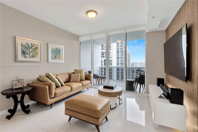 living room featuring light tile patterned floors and floor to ceiling windows