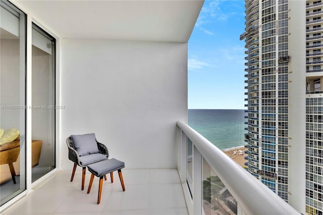 balcony featuring a water view