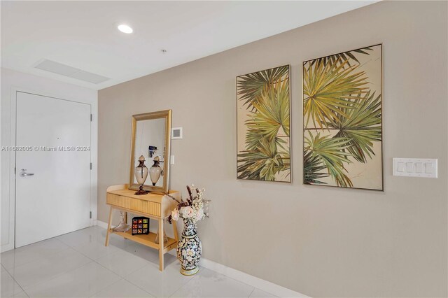18201 Collins Ave Unit 1905, Sunny Isles Beach, FL 33160 - corridor with baseboards, recessed lighting, and tile patterned flooring