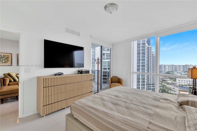 18201 Collins Ave Unit 1905, Sunny Isles Beach, FL 33160 - tiled bedroom with multiple windows and a wall of windows
