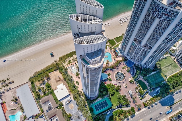 bird's eye view featuring a water view and a view of the beach