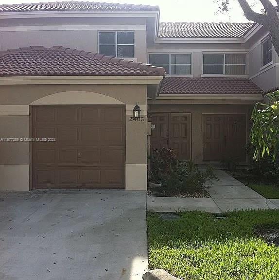 view of front of property with a garage