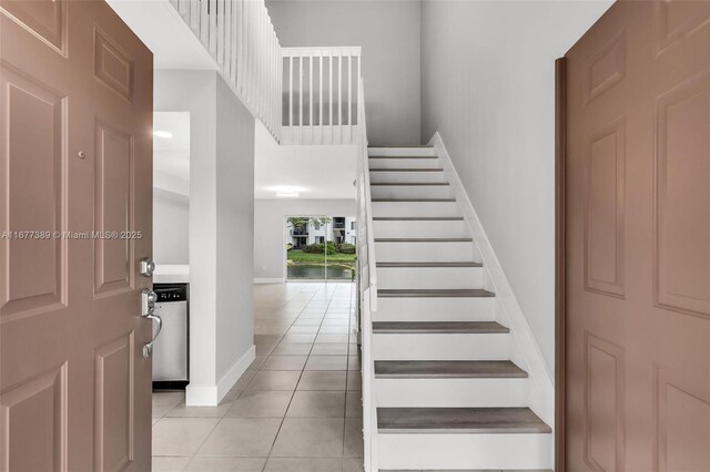 2394 NW 97th Way Unit 2394, Pembroke Pines, FL 33024 - stairs with tile patterned floors and baseboards