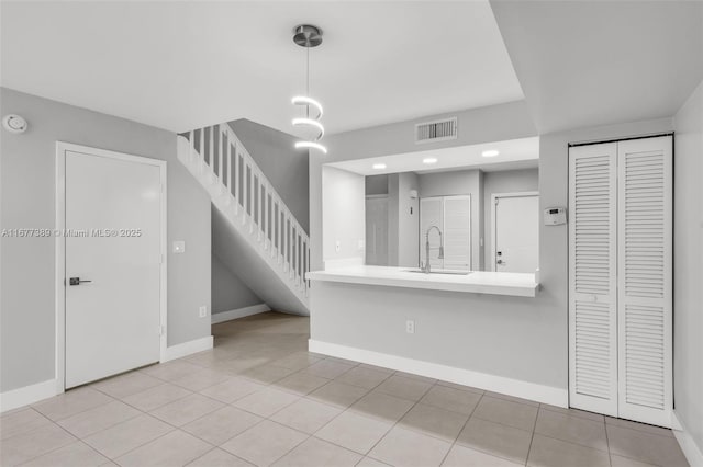2394 NW 97th Way Unit 2394, Pembroke Pines, FL 33024 - kitchen with recessed lighting, light tile patterned flooring, light countertops, and pendant lighting