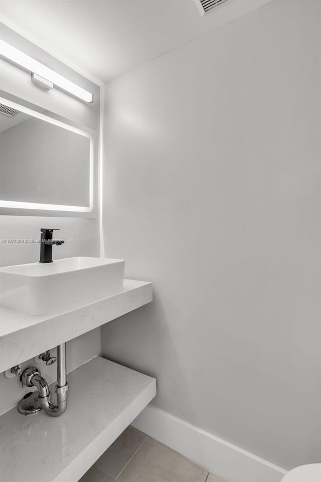 2394 NW 97th Way Unit 2394, Pembroke Pines, FL 33024 - bathroom with tile patterned floors and baseboards