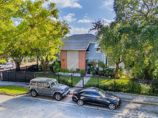 405 SW 11th Ave, Miami, FL 33130 - obstructed view of property featuring a shingled roof
