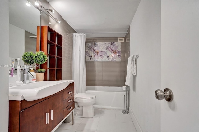 full bath featuring shower / bath combination with curtain, toilet, vanity, baseboards, and tile patterned floors