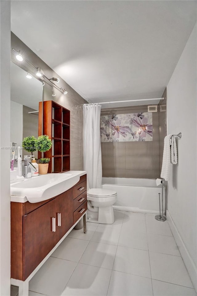 bathroom with toilet, visible vents, vanity, tile patterned floors, and shower / bath combo with shower curtain