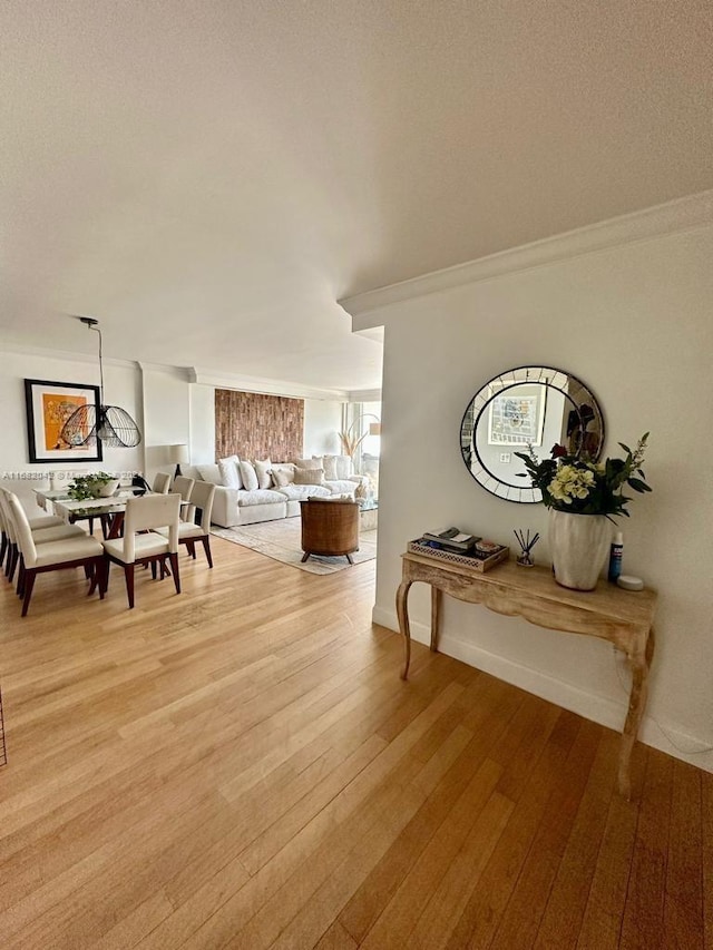 dining room featuring crown molding and hardwood / wood-style floors