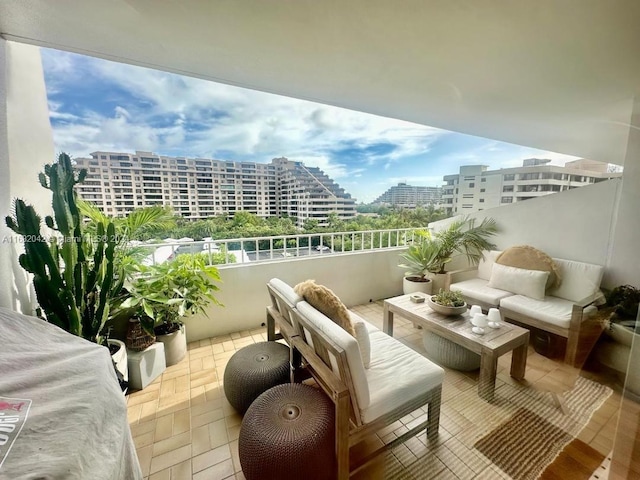 199 Ocean Lane Dr Unit 613, Key Biscayne, FL 33149 - balcony with a city view and an outdoor hangout area