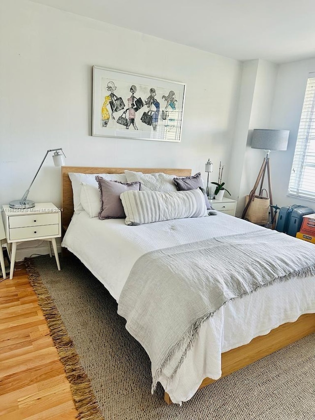 bedroom with hardwood / wood-style floors