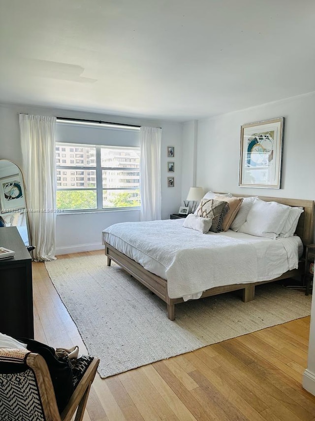 bedroom with light hardwood / wood-style flooring