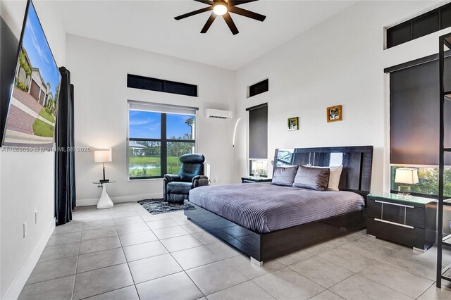 living room featuring light tile patterned floors and ceiling fan