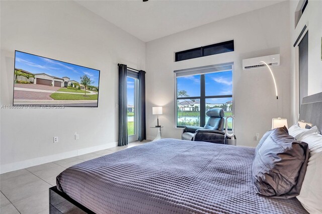 bedroom with a high ceiling, light tile patterned floors, and ceiling fan