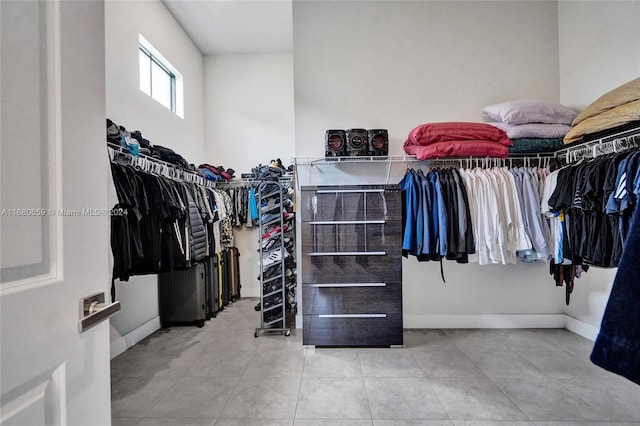 walk in closet featuring light tile patterned floors