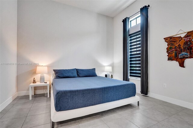 bedroom featuring light tile patterned floors