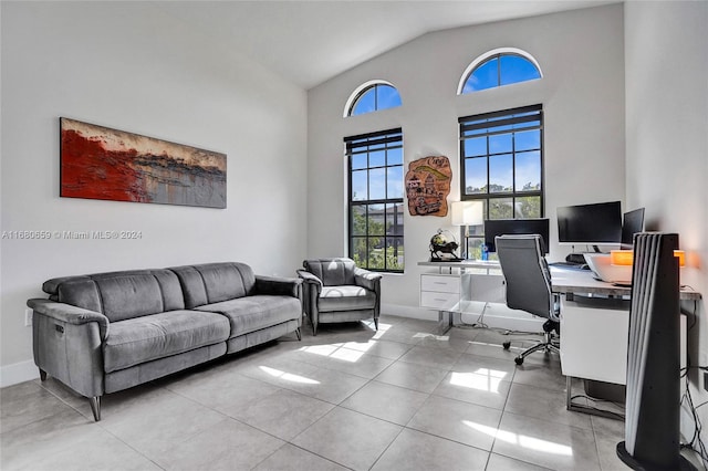 office featuring high vaulted ceiling and light tile patterned floors