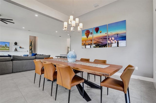 dining space featuring ceiling fan with notable chandelier