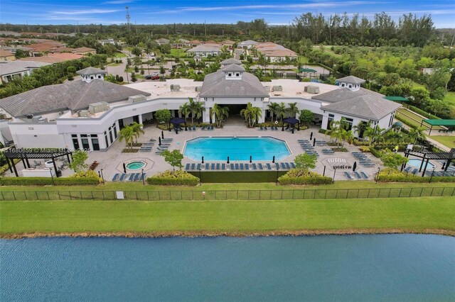 birds eye view of property with a water view