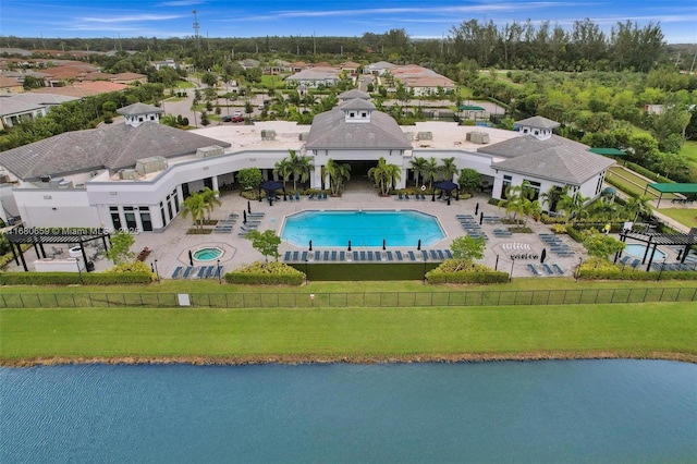 drone / aerial view featuring a water view and a residential view