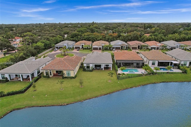 bird's eye view featuring a water view and a wooded view