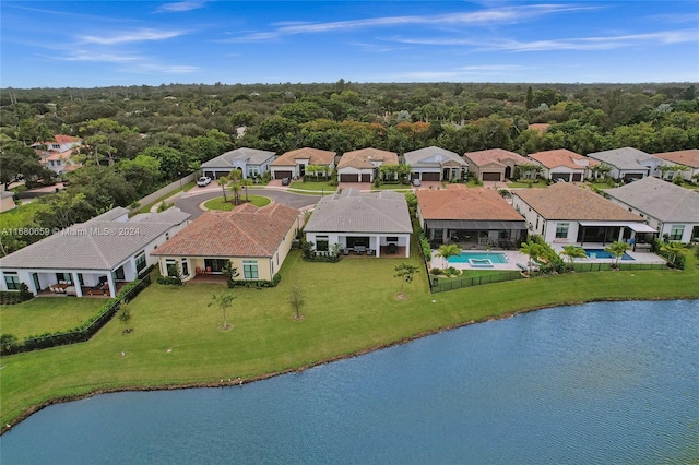 birds eye view of property with a water view