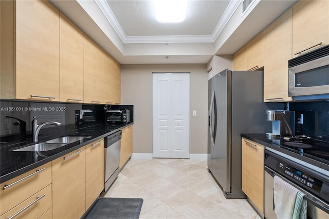 kitchen with sink, crown molding, light brown cabinets, and appliances with stainless steel finishes