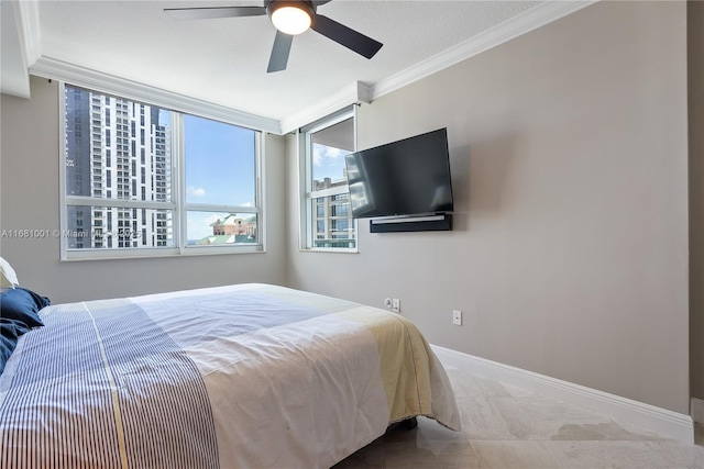 bedroom with crown molding and ceiling fan