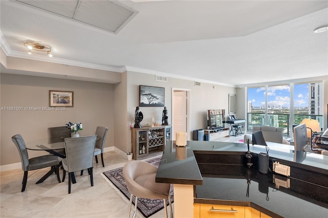 office with crown molding and a wall of windows