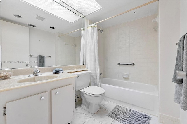 full bathroom featuring vanity, shower / bath combination with curtain, and toilet