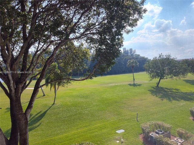 view of home's community featuring a lawn