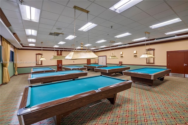 recreation room featuring carpet flooring, a drop ceiling, ornamental molding, and billiards