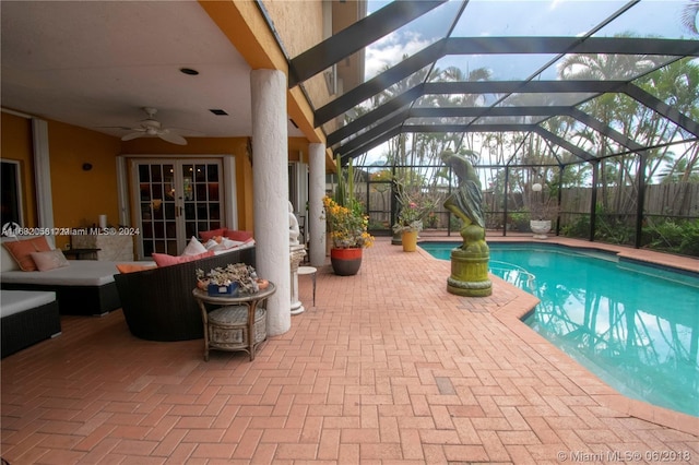 view of pool with a patio, outdoor lounge area, a lanai, and ceiling fan