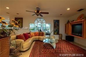 living room with ceiling fan