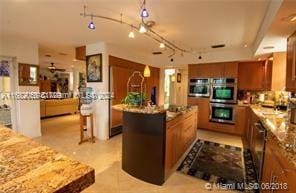 kitchen with appliances with stainless steel finishes and a center island