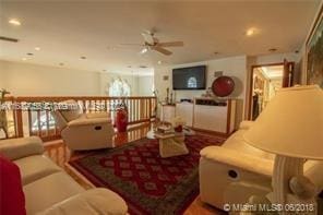 living room featuring ceiling fan