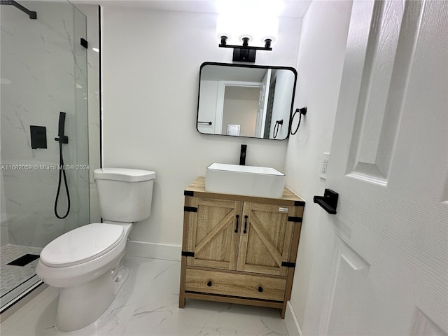 bathroom with a tile shower, toilet, and vanity