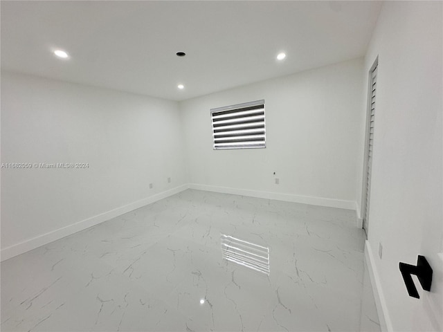 10735 SW 3rd St Unit 3, Sweetwater, FL 33174 - unfurnished room featuring baseboards, recessed lighting, and marble finish floor
