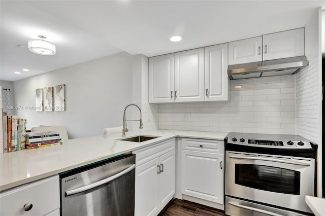 kitchen featuring sink, appliances with stainless steel finishes, dark hardwood / wood-style floors, and white cabinets