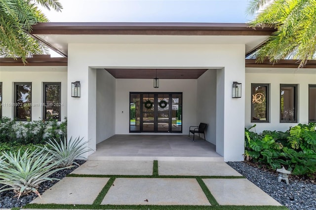 view of exterior entry featuring french doors