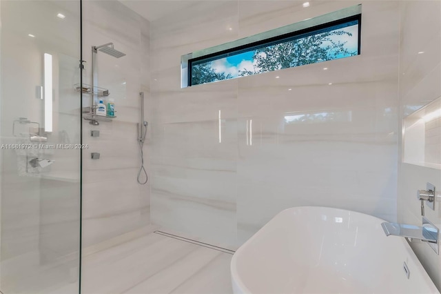 bathroom with separate shower and tub