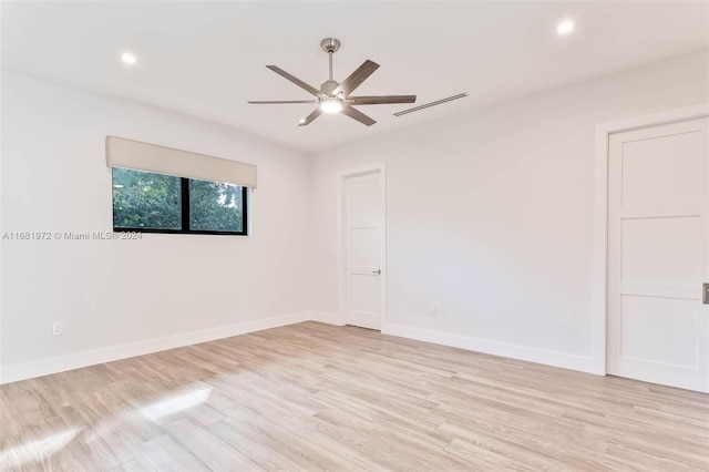 empty room with light wood-type flooring and ceiling fan