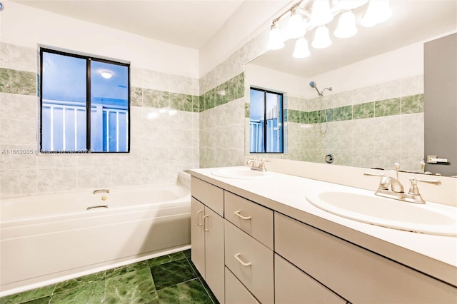 bathroom featuring separate shower and tub and vanity