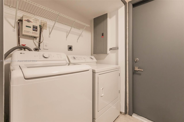 laundry area with independent washer and dryer and electric panel