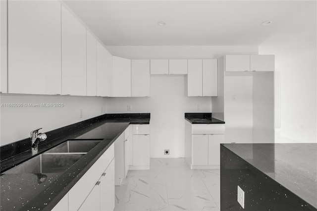 kitchen with sink and white cabinets