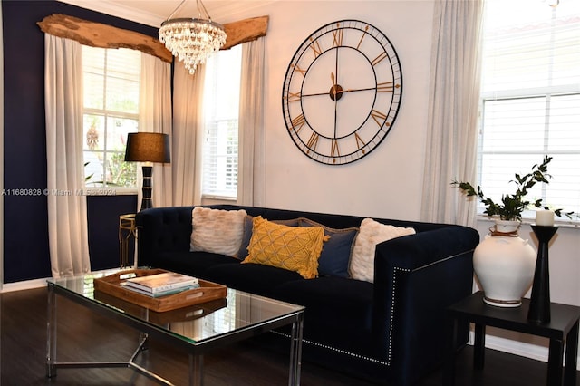 living room featuring a chandelier and dark wood-type flooring