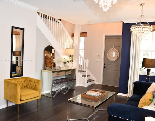 living room featuring crown molding, plenty of natural light, dark hardwood / wood-style floors, and a notable chandelier