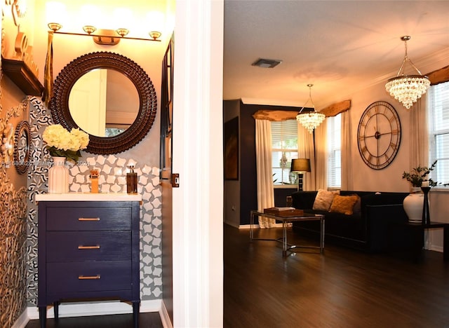 interior space with a notable chandelier, dark hardwood / wood-style flooring, and a wealth of natural light