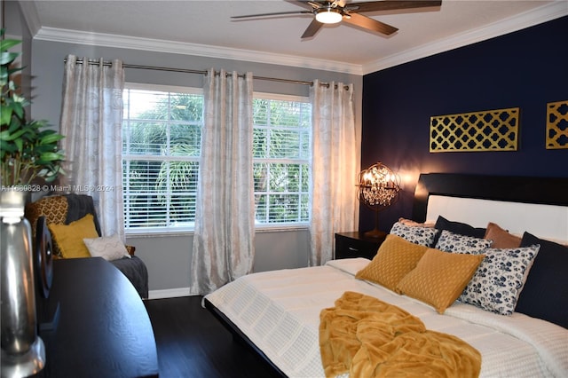 bedroom featuring hardwood / wood-style flooring, ceiling fan, and crown molding