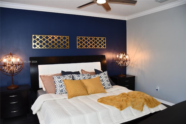 bedroom featuring ceiling fan with notable chandelier and crown molding